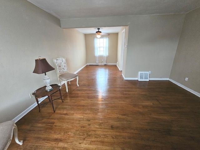 spare room featuring ceiling fan and dark hardwood / wood-style flooring