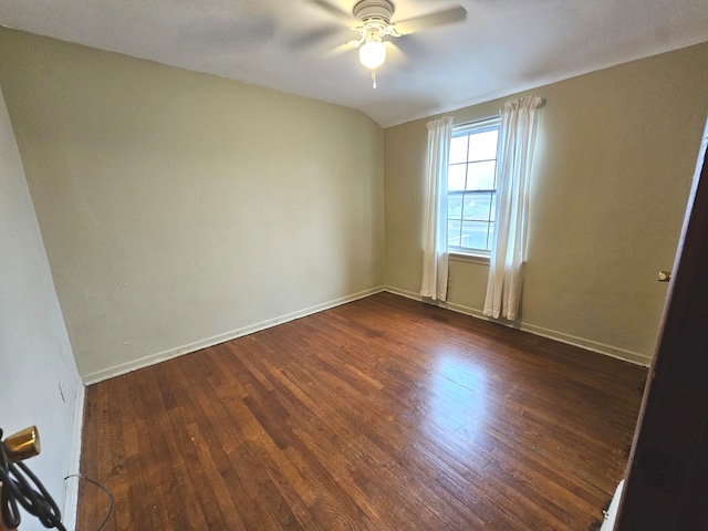 unfurnished room with vaulted ceiling, ceiling fan, and dark hardwood / wood-style floors