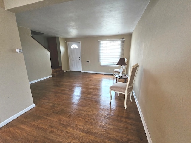 foyer with dark hardwood / wood-style flooring