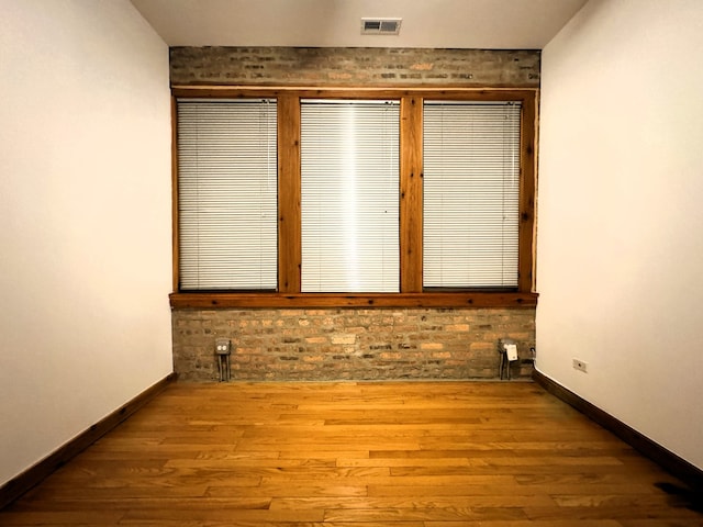 unfurnished bedroom featuring hardwood / wood-style flooring