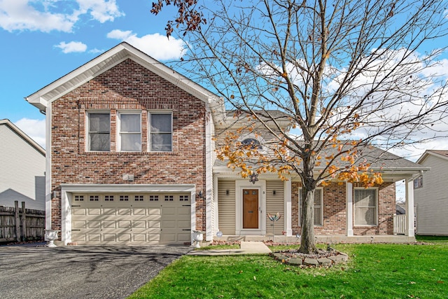 view of property with a garage and a front yard