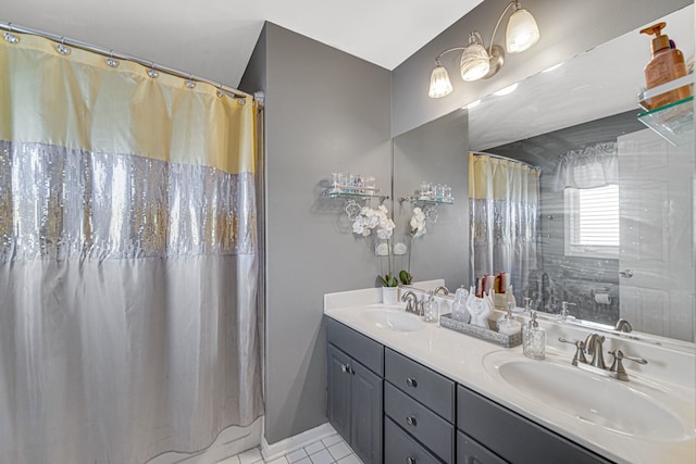 bathroom featuring tile patterned floors, vanity, and walk in shower