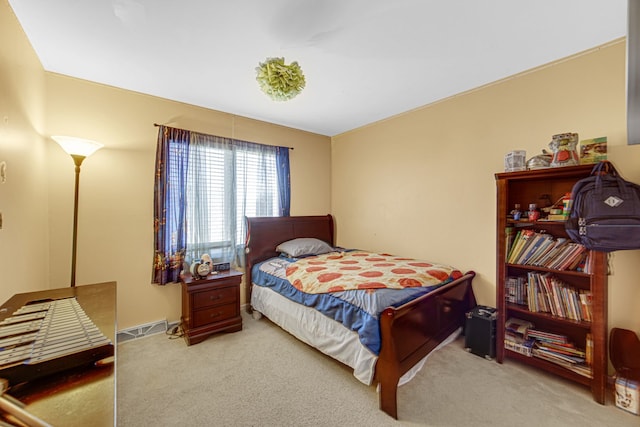 bedroom featuring light colored carpet