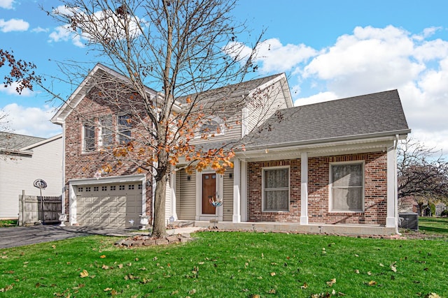 front of property with a front yard, central AC, and a garage