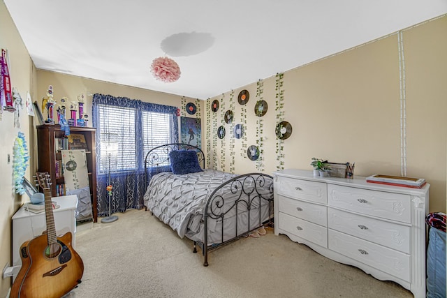 bedroom with light colored carpet