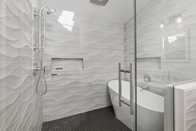 bathroom featuring tile patterned floors and separate shower and tub