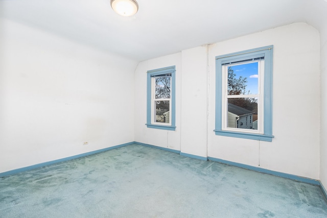 spare room featuring carpet flooring and a healthy amount of sunlight