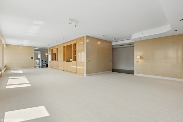 unfurnished room featuring light colored carpet