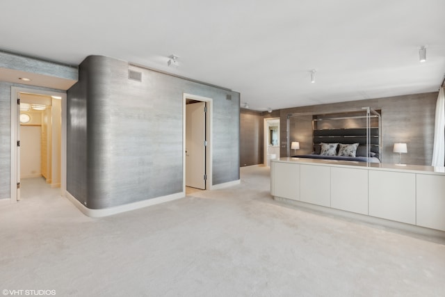 unfurnished living room with light carpet