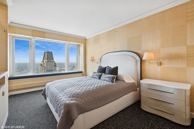 bedroom with carpet, ornamental molding, and wood walls