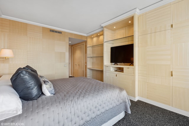 carpeted bedroom with crown molding