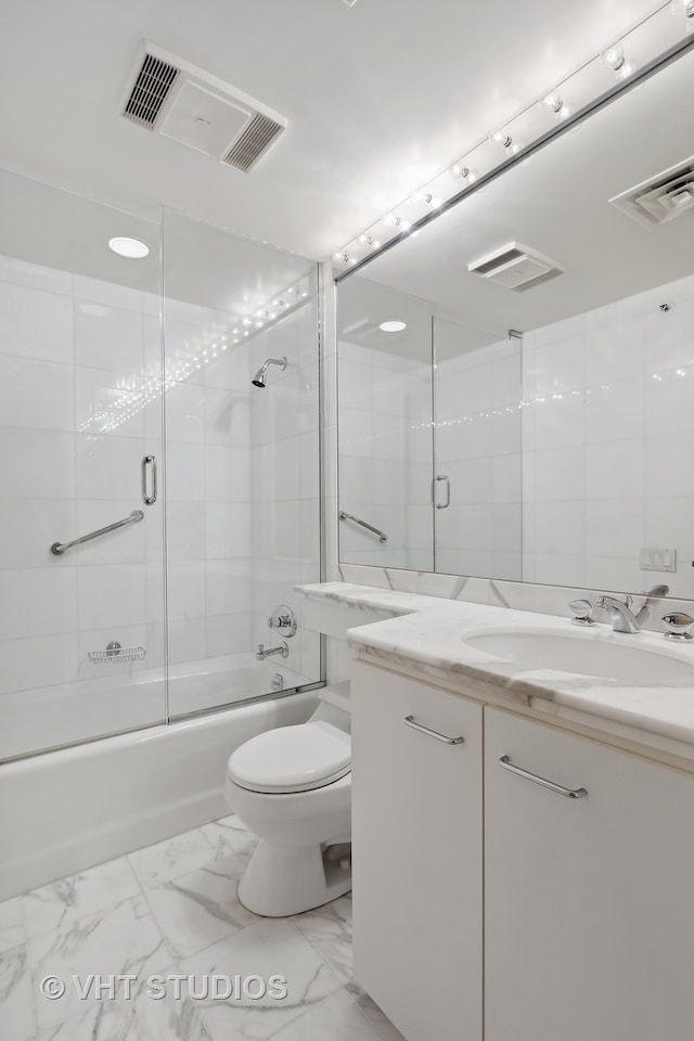 full bathroom with toilet, vanity, and combined bath / shower with glass door