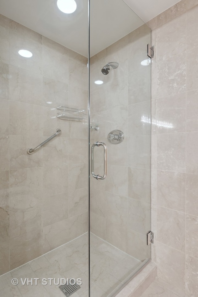 bathroom featuring an enclosed shower