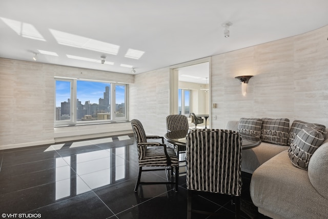 dining room featuring dark tile patterned floors