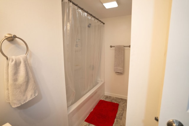 bathroom with shower / bath combination with curtain