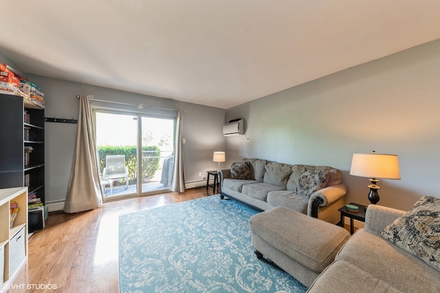 living room with a baseboard radiator, a wall mounted AC, and light hardwood / wood-style flooring