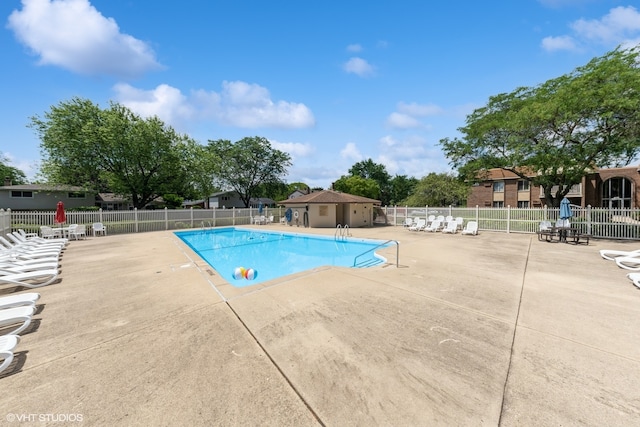 view of swimming pool with a patio area