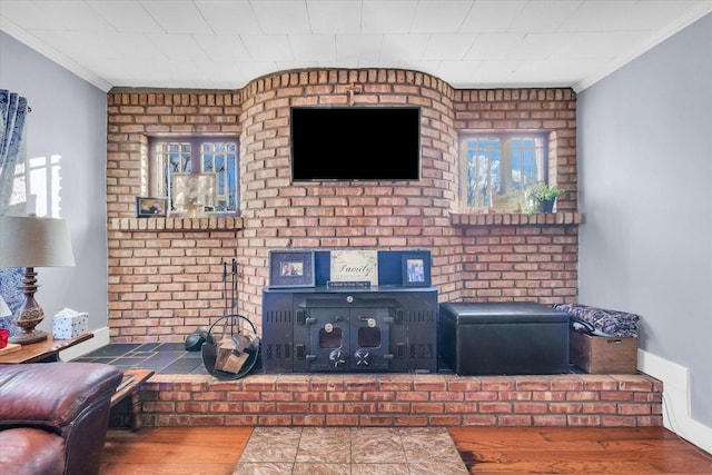 interior details with hardwood / wood-style flooring and crown molding