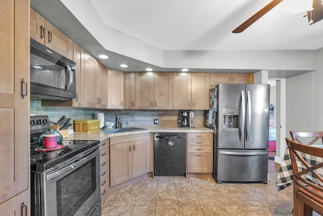 kitchen with appliances with stainless steel finishes, tasteful backsplash, light brown cabinetry, and sink