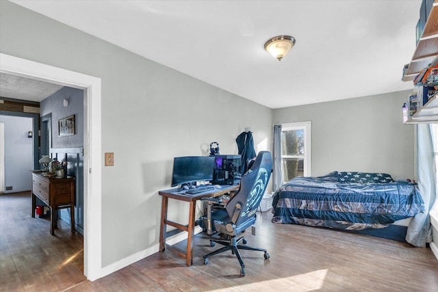 bedroom featuring hardwood / wood-style floors