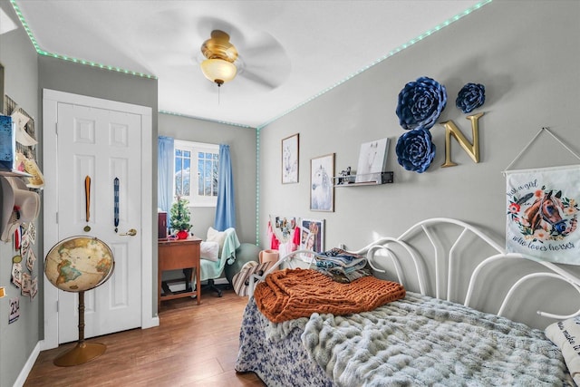 bedroom with ceiling fan and hardwood / wood-style floors