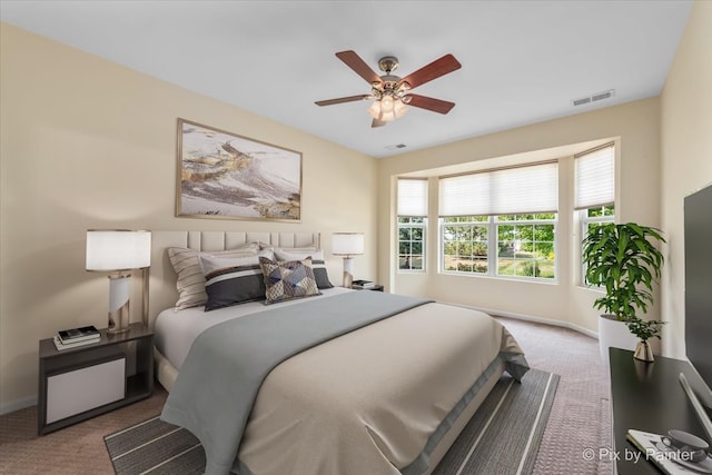 bedroom with ceiling fan and carpet floors