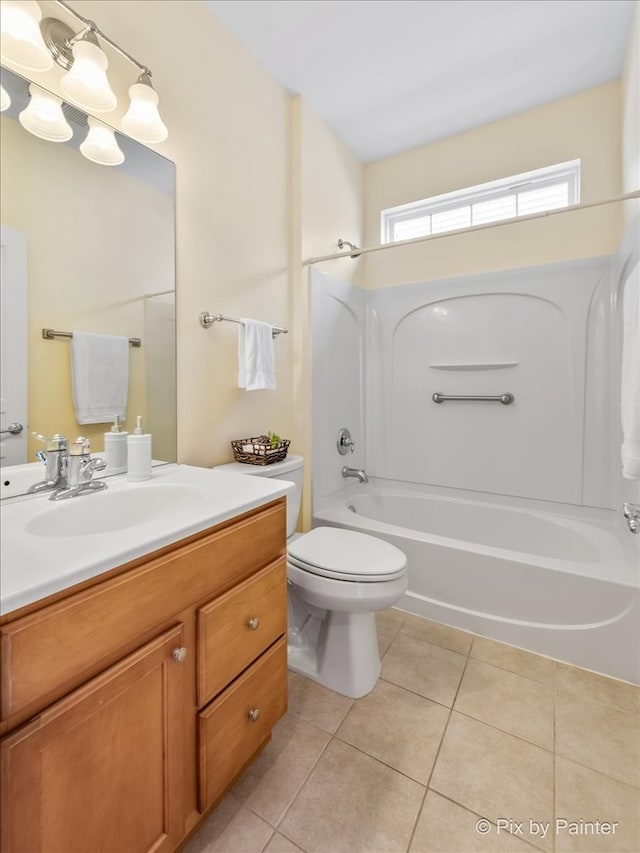 full bathroom with tile patterned flooring, bathtub / shower combination, vanity, and toilet