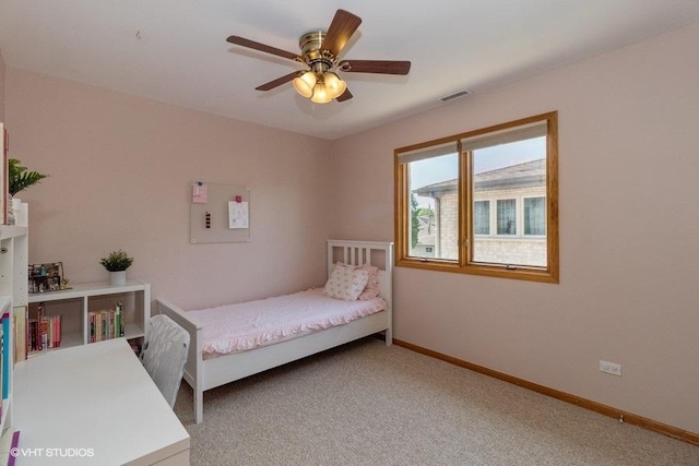 bedroom featuring ceiling fan and carpet