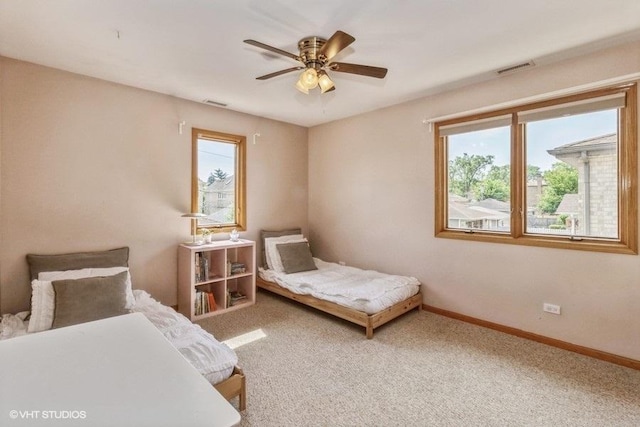 carpeted bedroom featuring ceiling fan