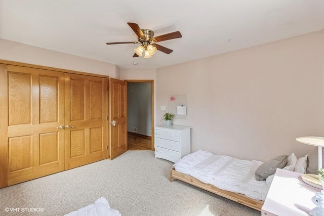 carpeted bedroom with ceiling fan