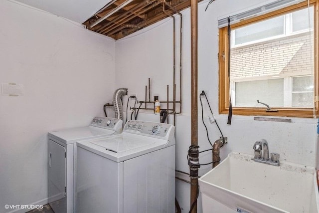 laundry area with sink and washer and clothes dryer