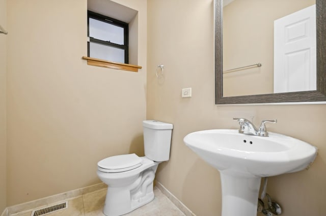 bathroom featuring tile patterned floors, sink, and toilet