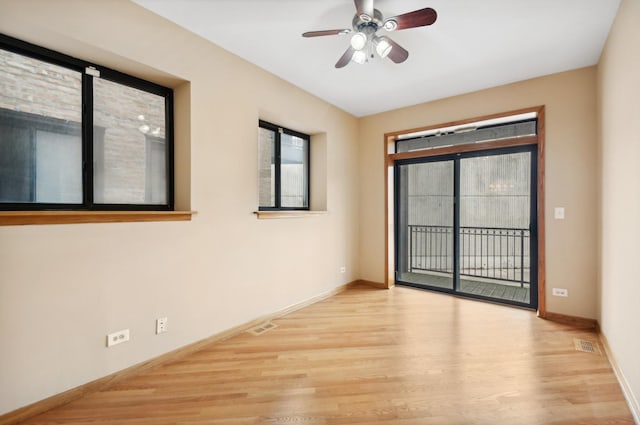 unfurnished room featuring ceiling fan and light hardwood / wood-style floors