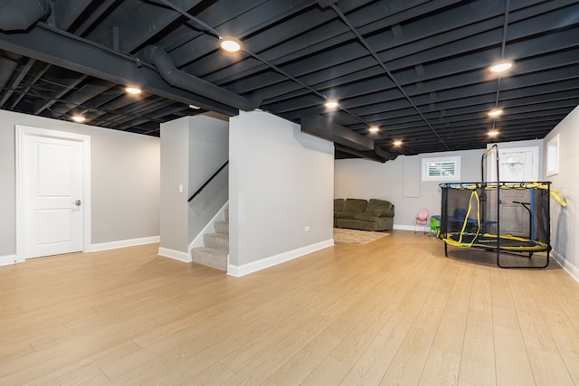 basement featuring light hardwood / wood-style flooring