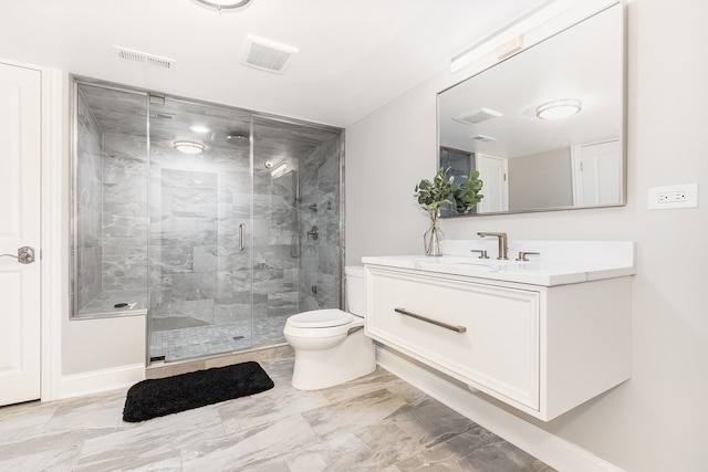 bathroom with a shower with door, vanity, and toilet