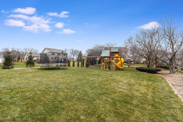 view of yard with a playground and a trampoline