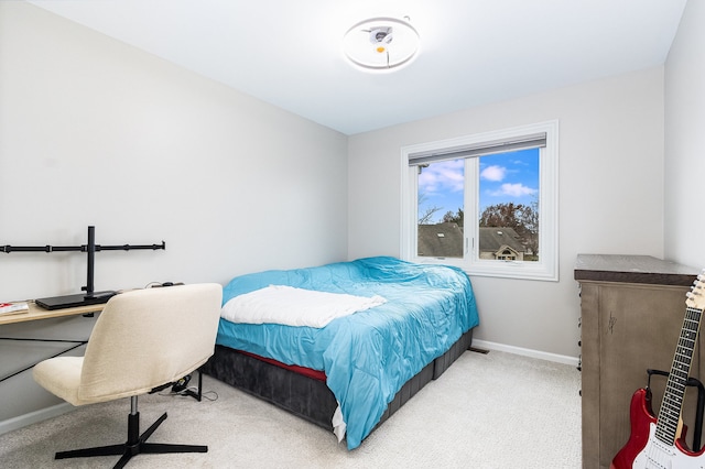 bedroom with light colored carpet