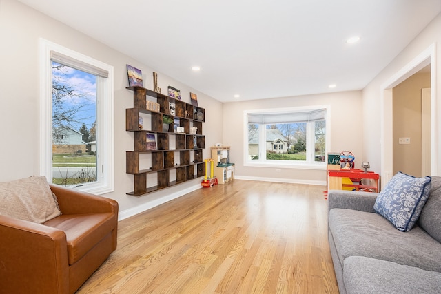 living area with light hardwood / wood-style floors