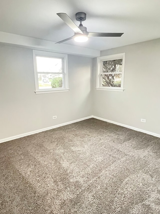 carpeted empty room with ceiling fan