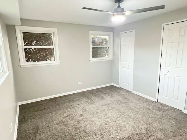 unfurnished bedroom featuring ceiling fan and carpet floors