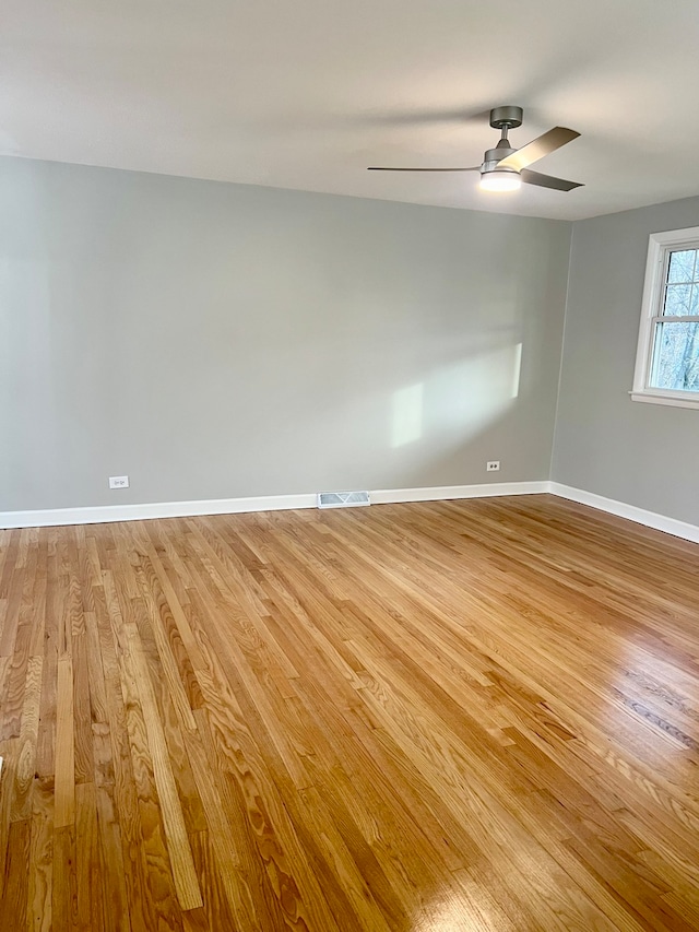 unfurnished room with ceiling fan and light hardwood / wood-style flooring