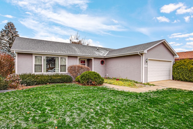 ranch-style home with a garage and a front yard