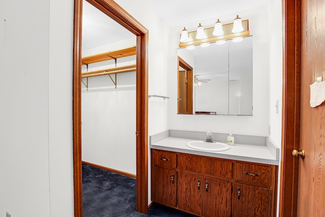 bathroom featuring vanity and ceiling fan