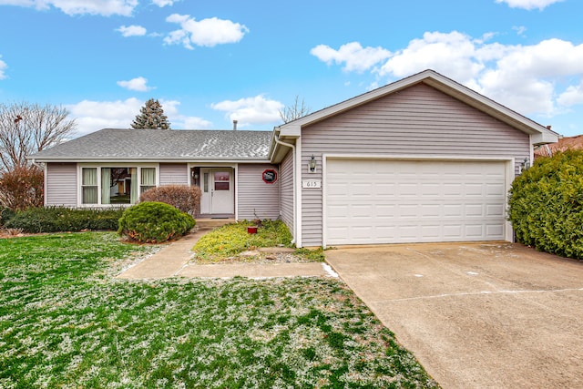 ranch-style home with a front yard and a garage