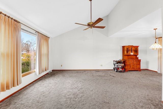 unfurnished living room with carpet flooring, ceiling fan, and a healthy amount of sunlight