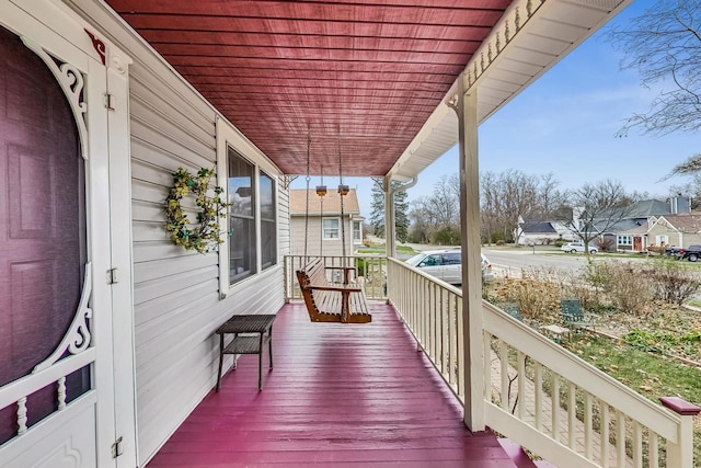 wooden terrace with a porch