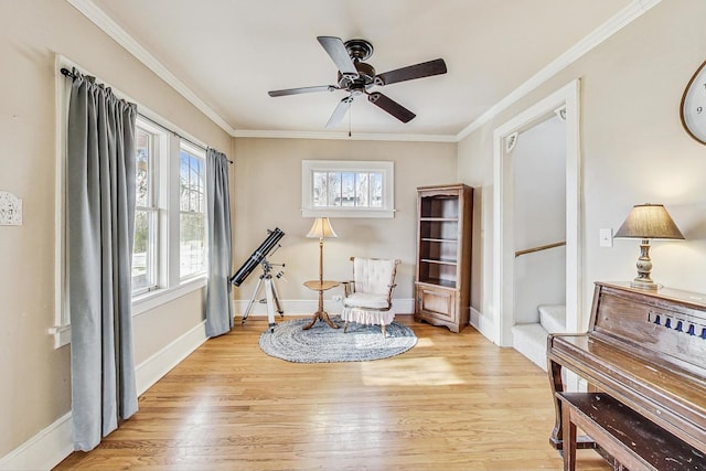 sitting room featuring ceiling fan, light hardwood / wood-style floors, and ornamental molding