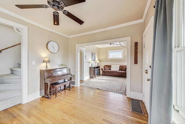 entrance foyer featuring light hardwood / wood-style floors and ornamental molding