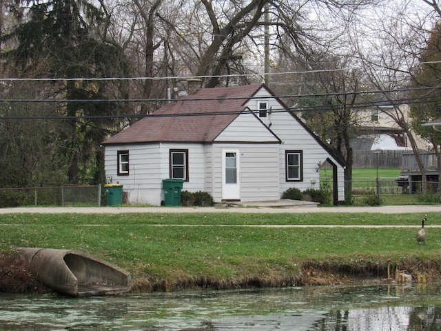 view of property exterior featuring a lawn