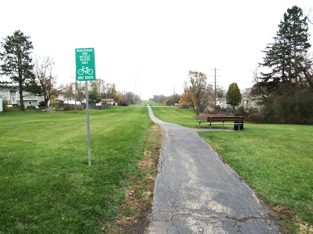 view of property's community with a lawn